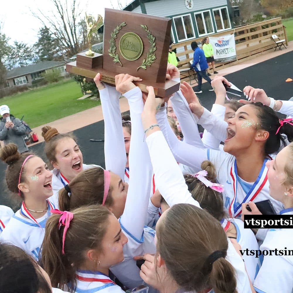 The South Burlington Wolves celebrate with the trophy after their 2-1 overtime win over Rice in the D1 state championship game on Saturday morning at UVM.